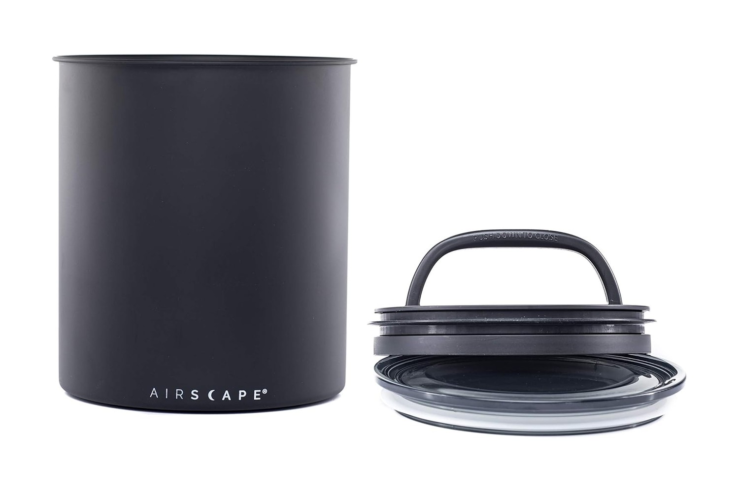 קופסת אחסון לקפה Airscape בצבע שחור מט לצד מכסה הבוכנה והמכסה העליון